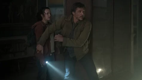Joel Miller (Pedro Pascal) and Ellie Williams (Bella Ramsay) sneaking through abandoned buildings. (PHOTO SOURCE: HBO)