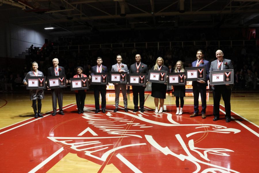(left to right) Dawn Rippelmeyer, Dr. Rich Erickson, Bob Gablers wife Carole Gabler, Mike Haverty, Nick Linne, Kevin Noel, Abbey Kerth, Amanda Fox, Mark Menis, and David Elliott hold their Athletic Hall of Fame plaques after the induction ceremony on Feb. 3. 