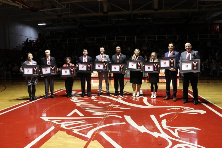 (left to right) Dawn Rippelmeyer, Dr. Rich Erickson, Bob Gabler's wife Carole Gabler, Mike Haverty, Nick Linne, Kevin Noel, Abbey Kerth, Amanda Fox, Mark Menis, and David Elliott hold their Athletic Hall of Fame plaques after the induction ceremony on Feb. 3. 