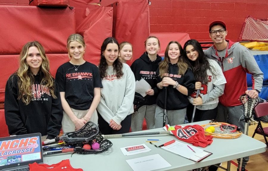 New girls lacrosse head coach Christian Pilapil (far right) at 8th grade orientation with members of the lacrosse team. 