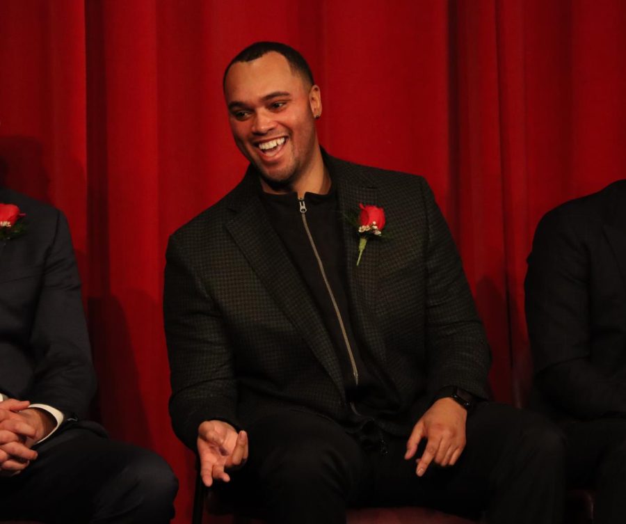 Kevin Noel talks on a panel during athletic hall of fame assembly.