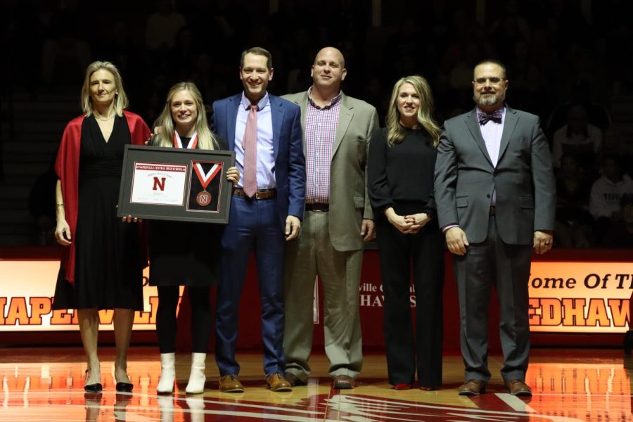 Amanda Fox holds hall of fame plaque after receiving it on Feb. 3. 