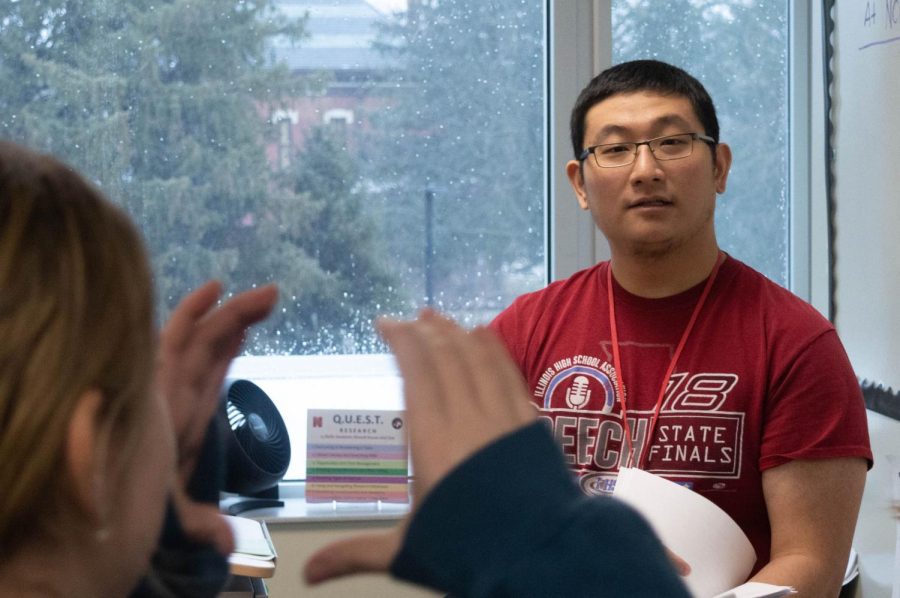 Jeremy Lin talks to a student in the speech room (rm. 214) on Feb. 16, a day before the team left to compete at the IHSA Speech State Finals.