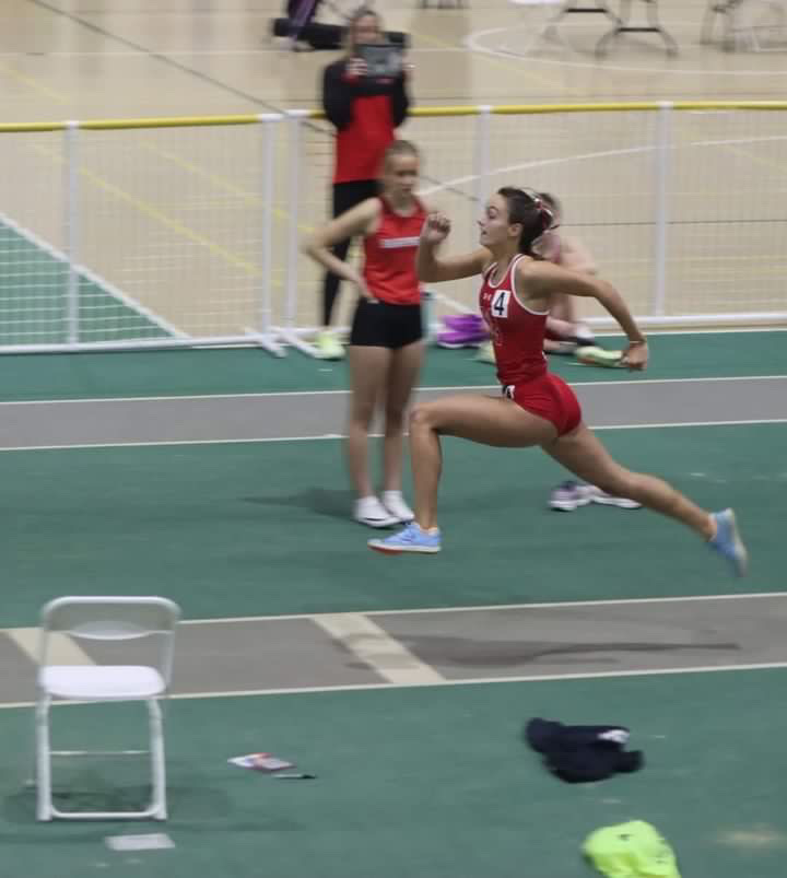 Junior Brooke Sawatzky jumps the triple jump at the York High School invite on Feb.17 where she placed first individually and the team placed first overall. 