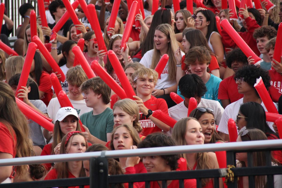 Centrals student section cheers on the varsity football scrimage at Centrals Red and White Night.