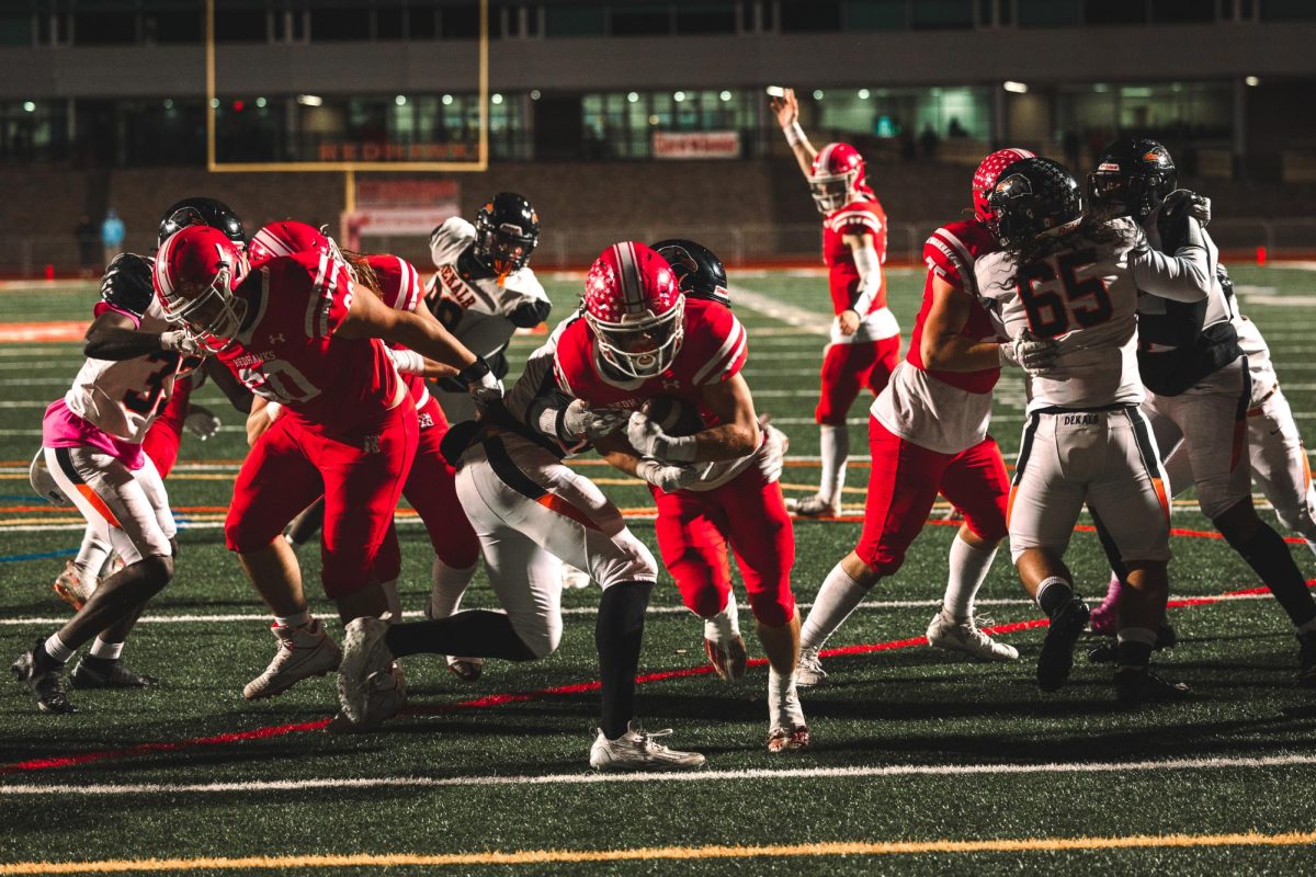 Junior running back Aiden Clark breaks a tackle on his way into the endzone for his first touchdown of the night in Centrals 42-0 home win over Dekalb on Oct. 6. 