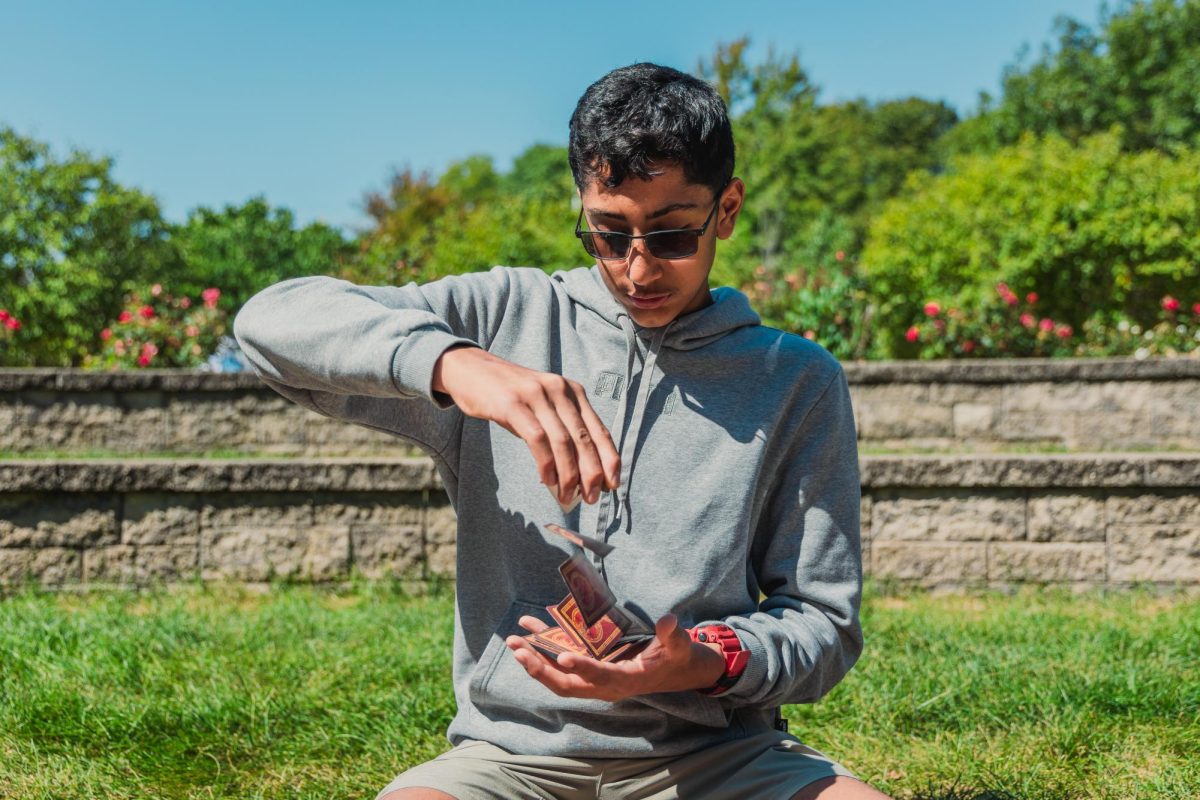 Freshman Yash Menon preforming a variation of a card spring, one of many tricks in his toolkit of entertainment. 