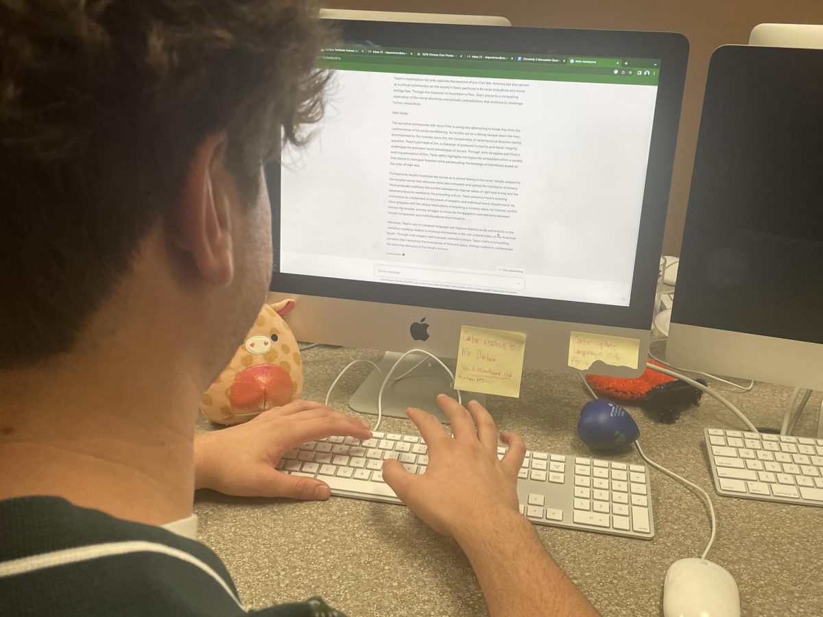Senior Christian Wenig uses ChatGPT after school in Room 216A on Monday, Oct. 23.