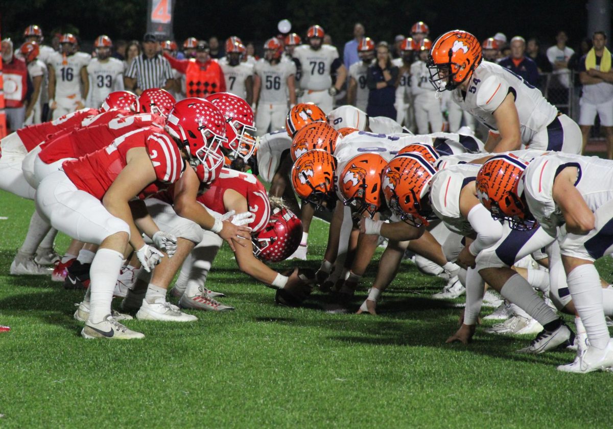 Central’s football team sets up for a kick attempt during the Crosstown Classic on Oct. 10 against Naperville North at North Central College. During the 2024 season, the annual matchup will be classified as a non-conference game due to a conference merger. 