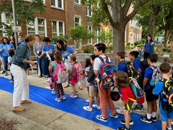 Students at Ellsworth Elementary celebrate winning a Blue Ribbon during their walk to school festivities.