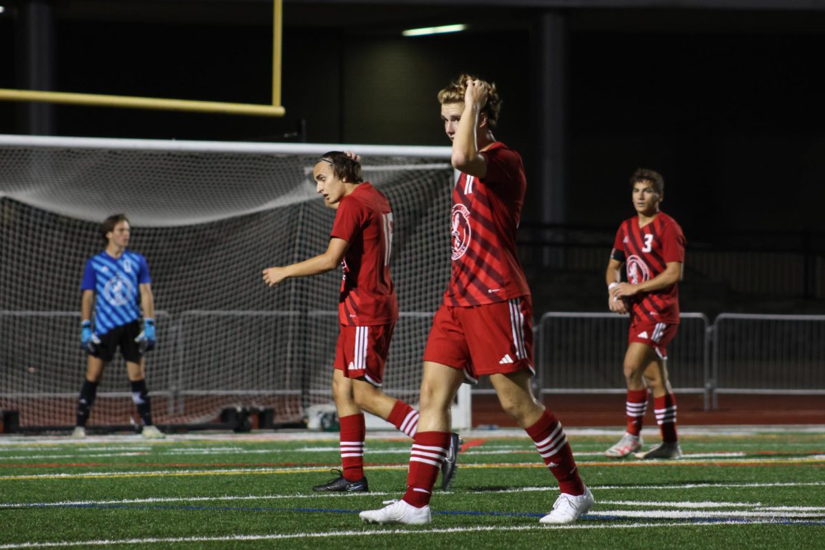 Seniors Blake Stevens (left) and Jackson Tritt (center) get into position during Centrals 5-0 win over DeKalb on Sept. 26.