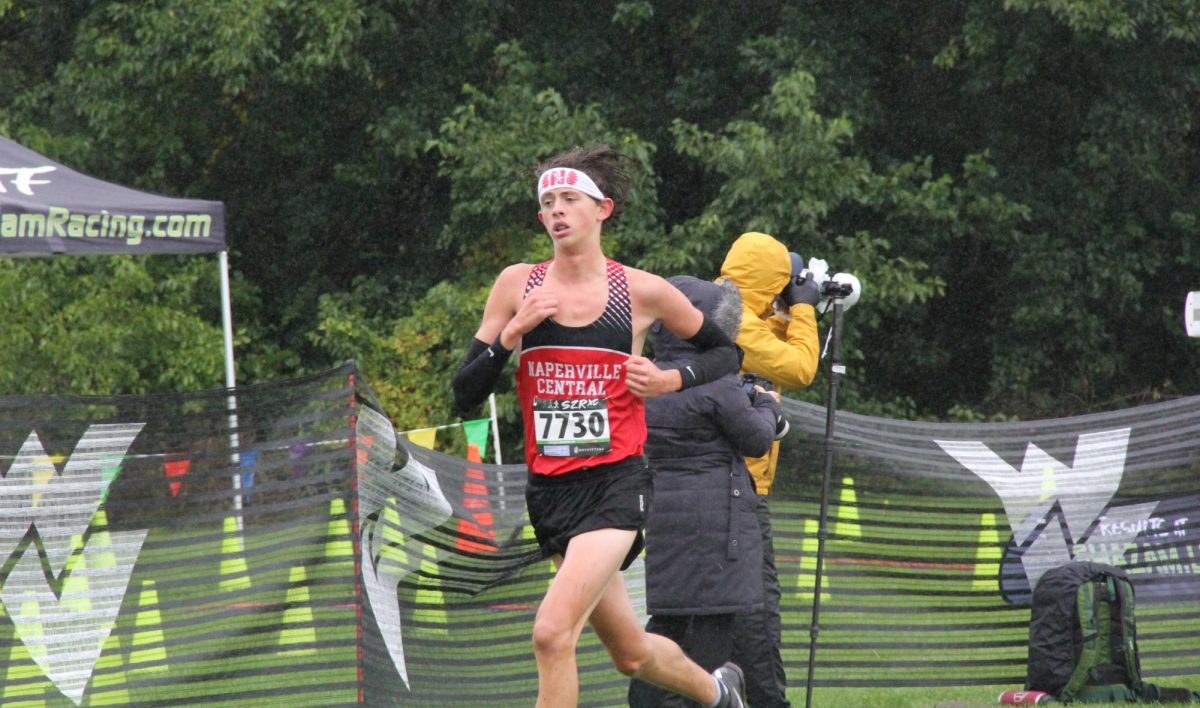 Senior Tyler Browning, a boys cross country team captain, runs at the DVC Championship on Oct. 14 at Waubonsie Valley. Browning finished the race in second place, with a time of 15 minutes and 44.6 seconds.