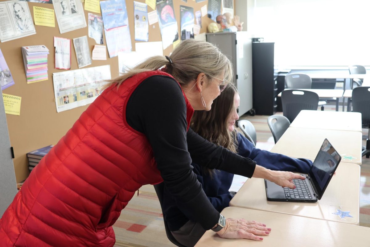 Social Studies teacher Cindy Tilt helps a student during a SOAR support period on Dec. 14.
