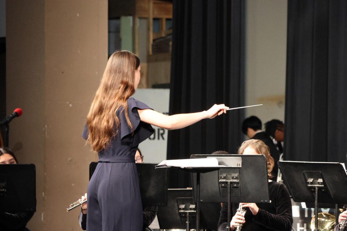 Senior Maeve Shamo conducts Centrals Symphonic Band at the Nov. 9 concert in Centrals auditorium.