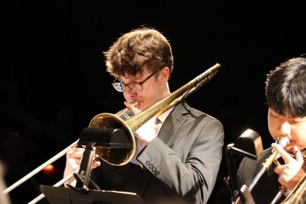 Sophomore Adam Fleming performs with Centrals Trombone Choir at the music departments Winter Festival on Dec. 8.