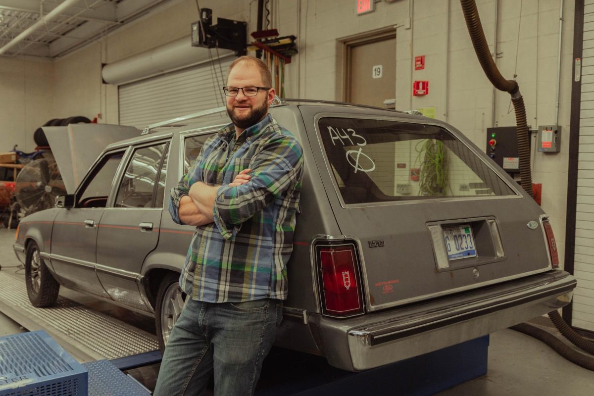 Automotive teacher Chris Feid, with help from a select group of his students, built and tuned a car from the 80s to reach 620 wheel horsepower on a dynamometer (blue machine pictured above).