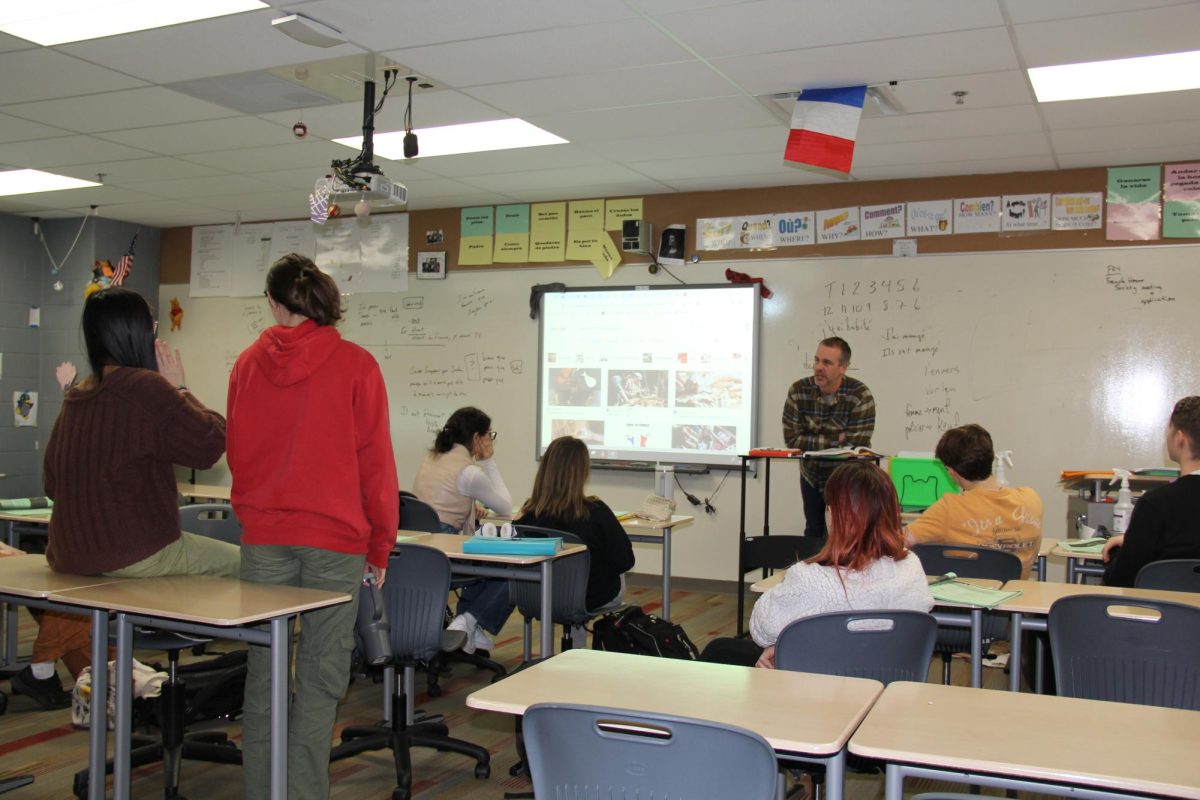 French teacher Jeremy Whitt leads his fifth period AP French class. New changes to middle school World and Classical Language classes may impact student readiness for high school French and Spanish classes, like those that Whitt teaches.