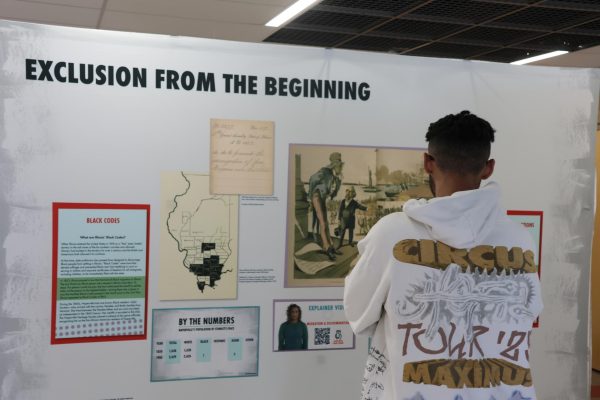 Senior Dylan Meadows explores the Unvarnished exhibit displayed on Centrals second floor with his African-American Literature class on Feb. 28.