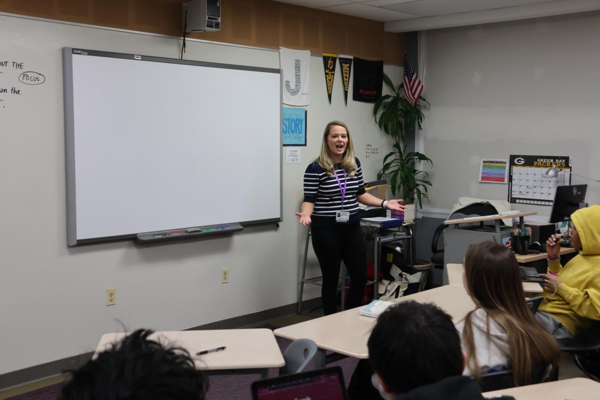 Substitute teacher Madalyn Eathington leads an Honors English 2: Journalism class on March 15. Substitute teacher pay rates have jumped by $20 over the past few years due to a shortage of subs.