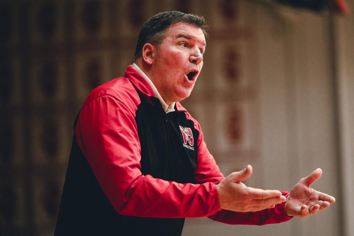 Boys basketball head coach Pete Kramer directs his team during their 51-43 victory over Oswego in the IHSA Regional Quarter Final on Feb. 19.