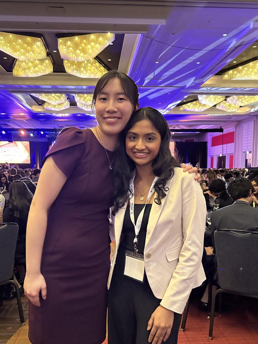 Seniors Athena Chen (left) and Anjali Shah (right) pose for a photo at DECA's state conference on Feb. 29.