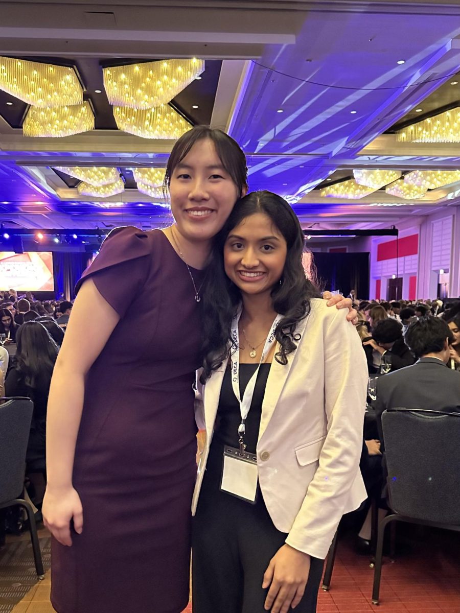 Seniors Athena Chen (left) and Anjali Shah (right) pose for a photo at DECAs state conference on Feb. 29.