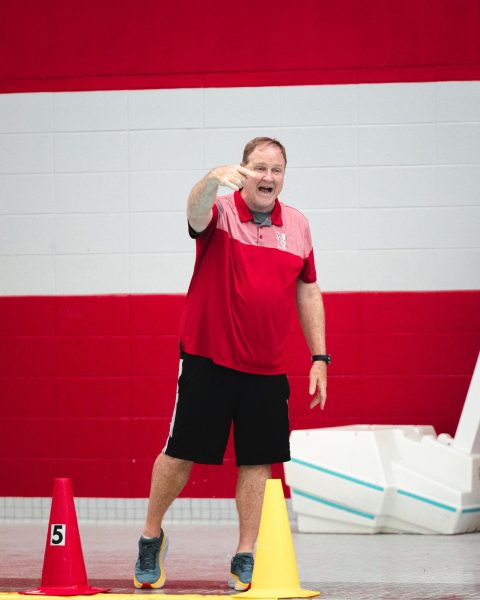 Varsity boys water polo coach William Salentine directs his team during a game against Barrington on April 18. Sal has coached the team for 23 years, winning over 80% of his games in that time.