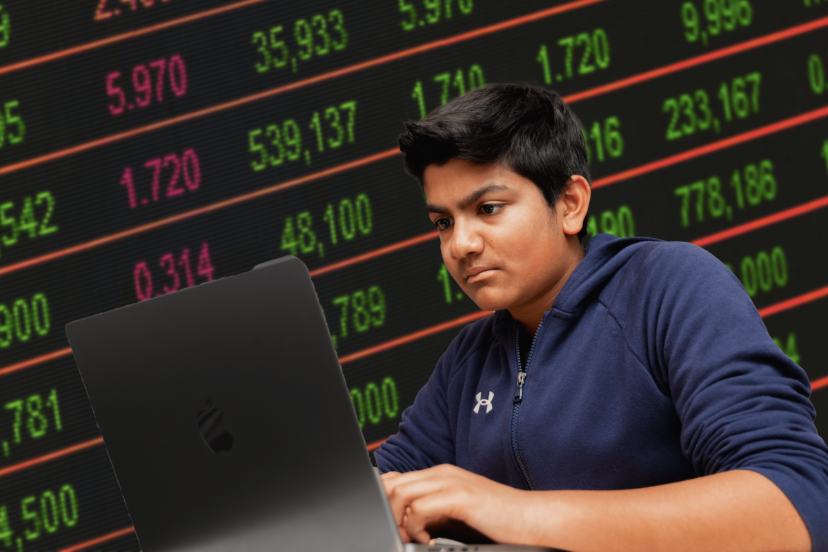 Sophomore+Deven+Patel+sits+at+his+computer+trading+stocks+during+his+lunch+period.+Patel+has+made+over+30+times+his+investment+by+trading+stocks.