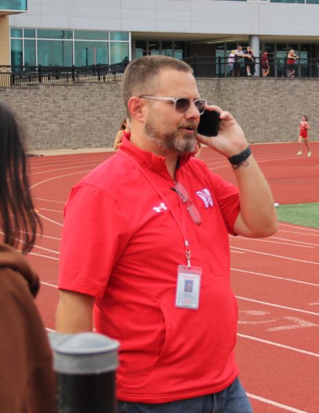 Athletic Director Chris Kirkpatrick watches over Red & White Night on Aug. 19, 2022. Kirkpatrick will be stepping down from his position on June 30.