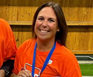 Caroline Schwartz poses for a photo at the 2nd Annual State Championship as Lane Tech's head coach. She now serves as head coach of Women’s Flag Football at Benedictine University. (Photo Credit: @BearsOutreach via X)