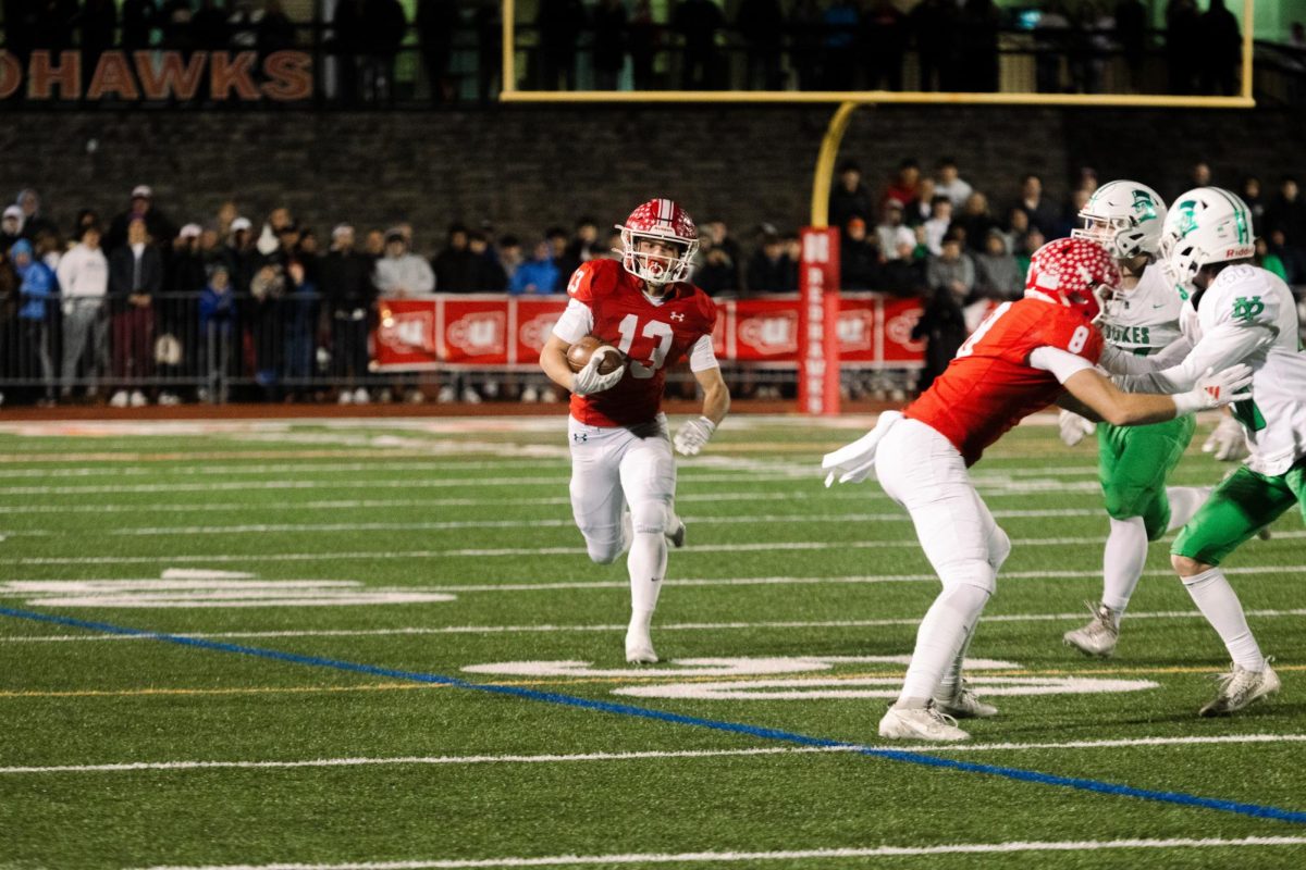 Senior Aiden Clark runs the ball downfield in an IHSA State Series Semifinal game against York on Nov. 23, 2024. Clark was named Central Times’ 2025 Male Athlete of the Year. 