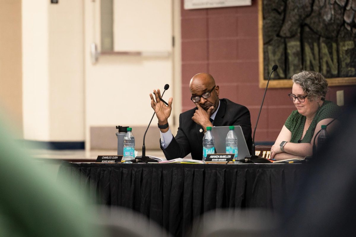 Board member Charles Cush raises his hand at the April 21 Board of Education meeting. The Innovative School Experience was meant to be voted on at the meeting, but the Board opted to table the agenda item instead.