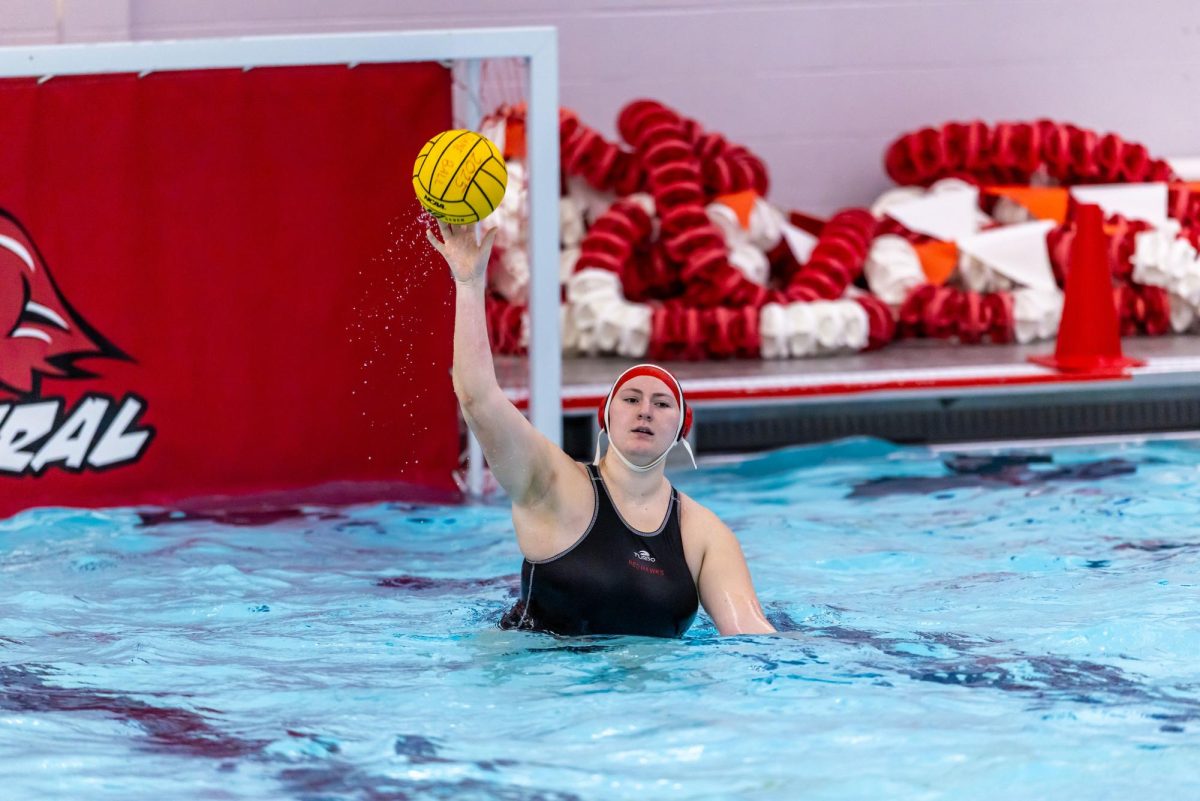 Senior Goalie Eleni Nicoloudes tosses a water polo ball after blocking a goal. Nicoloudes was named Central Times' 2025 Female Athlete of the Year. (Photo credit: Scotty D. Photography)