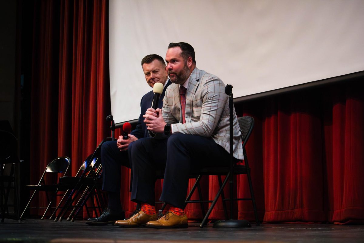 Distinguished alumni inductees Scott Wehrli (left) and Ben Winterrowd (right) participate in a Q&A in front of Naperville Central seniors on May 2.