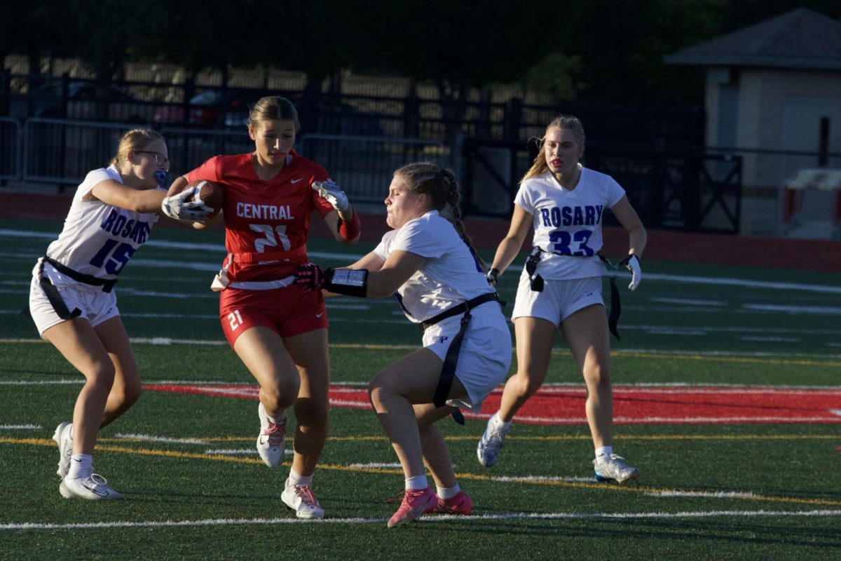 Sophomore Lacie Williams twists past two defenders during a game against Rosary on Aug. 28. Central won 19-6 in their first-ever game, marking a strong start to the program.