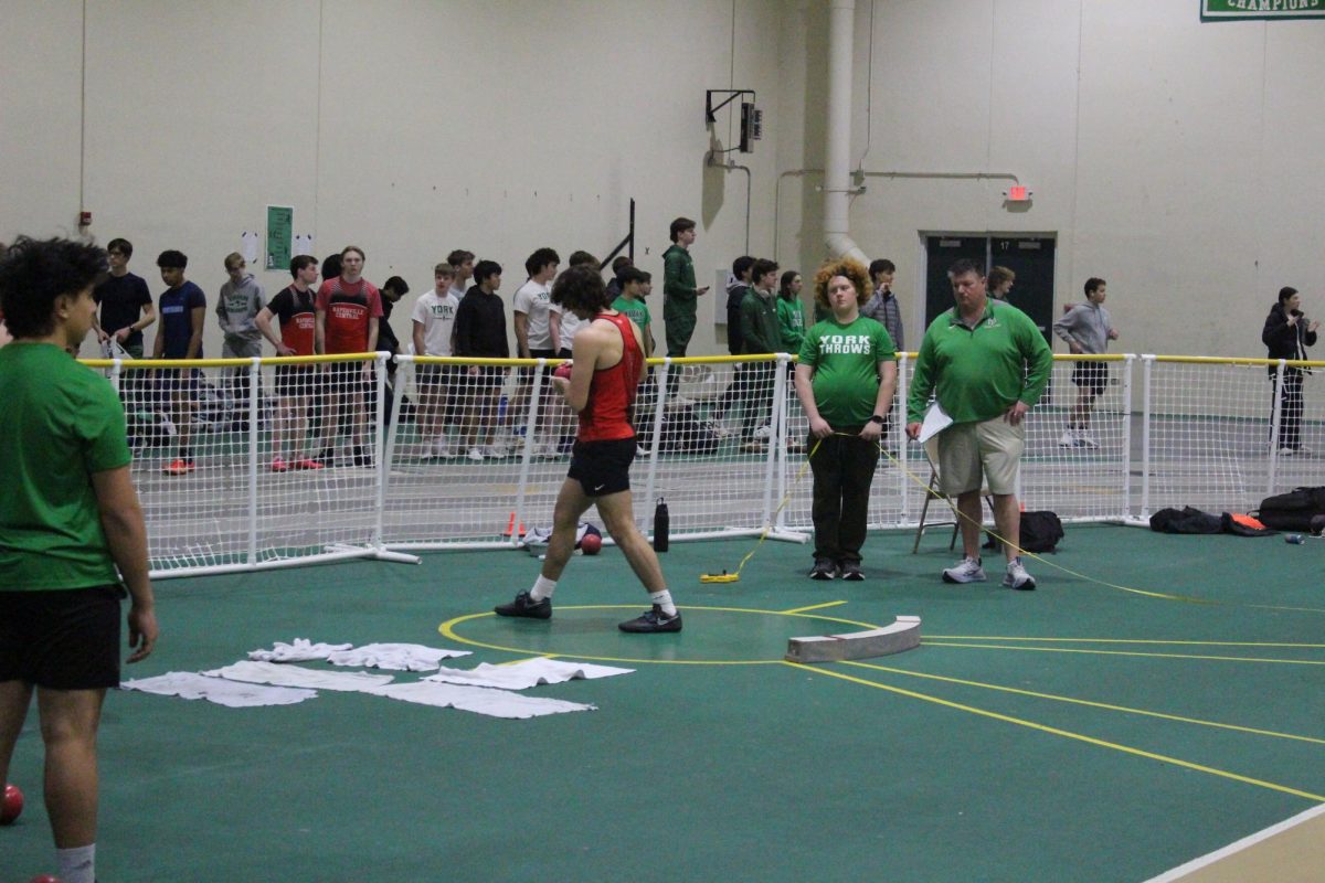 On Feb. 7 a quad meet took place at York High School and Naperville Central was was one of the four schools that attended. Ben Blank is seen setting up for a 58’ 3” mark before throwing his shot put at the meet. PHOTO CREDIT: BEN BLANK